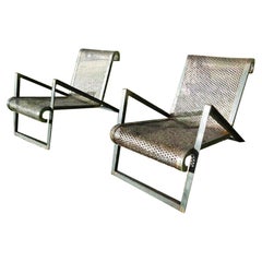 Pair of perforated metal garden armchairs France