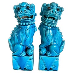 Antique Chinese Foo Dog statues in turquoise glaze