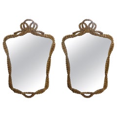 Coppia di specchi italiani in legno dorato con corda e nappe
