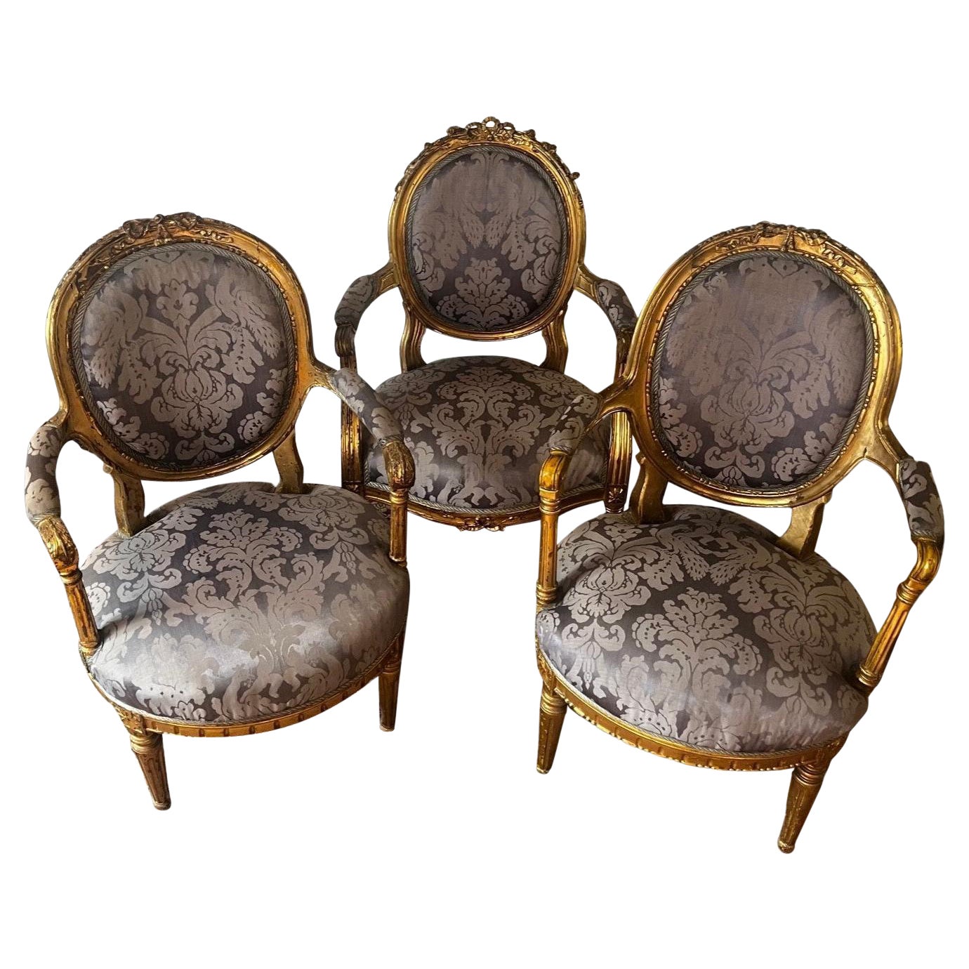 The Set of Three Original 18th Century Louis XVI Gold Gilded Armchairs For Sale