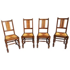 Antique 1920’s English Carved Oak Rush Back and Seat Chairs, a Set of 4