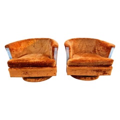 Pair of 1960’s Orange Crushed Velvet Swivel Chairs