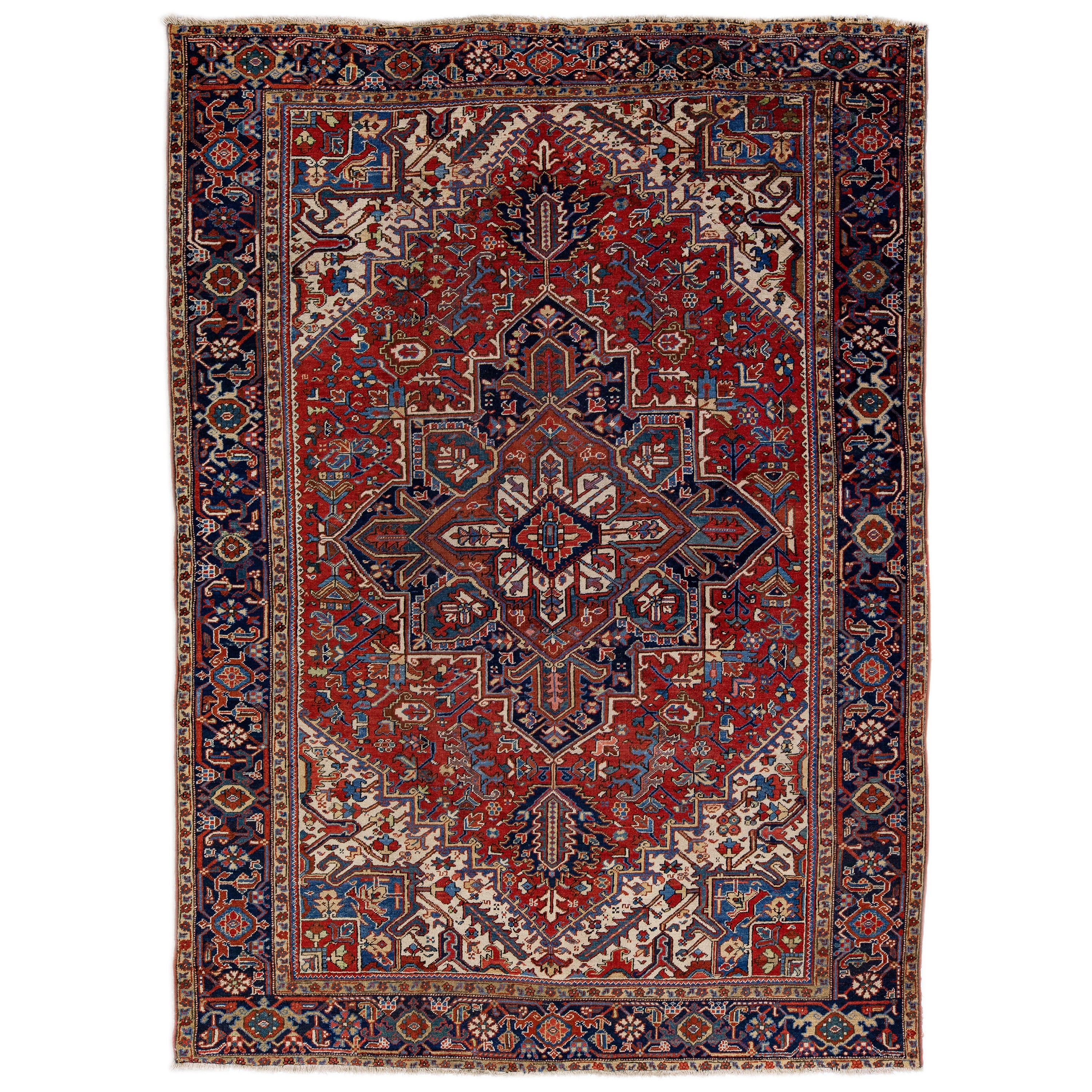 Antique Heriz Red Handmade Persian Wool Rug with Multicolor Medallion Design For Sale