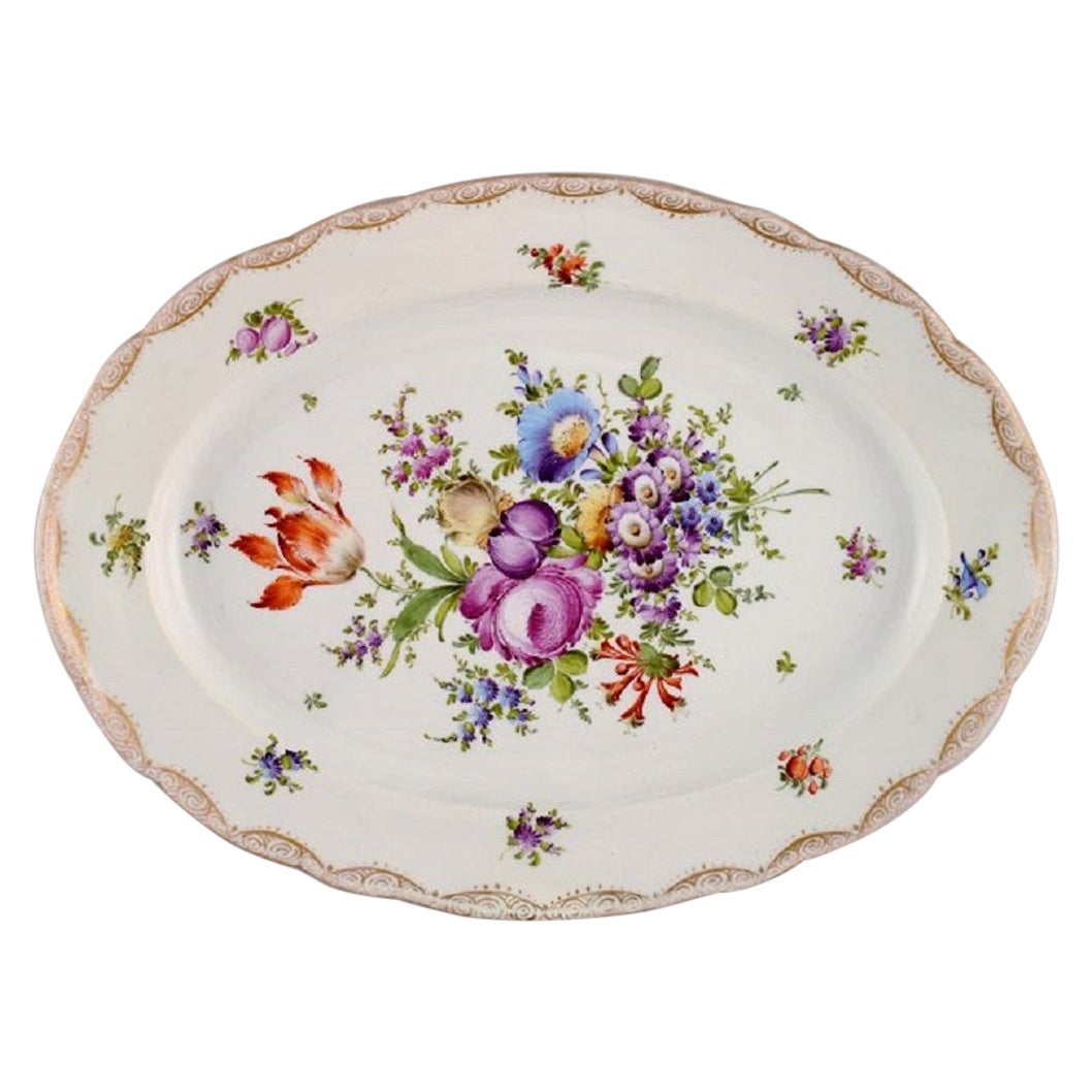 Large Meissen serving dish in porcelain with hand-painted flowers.
