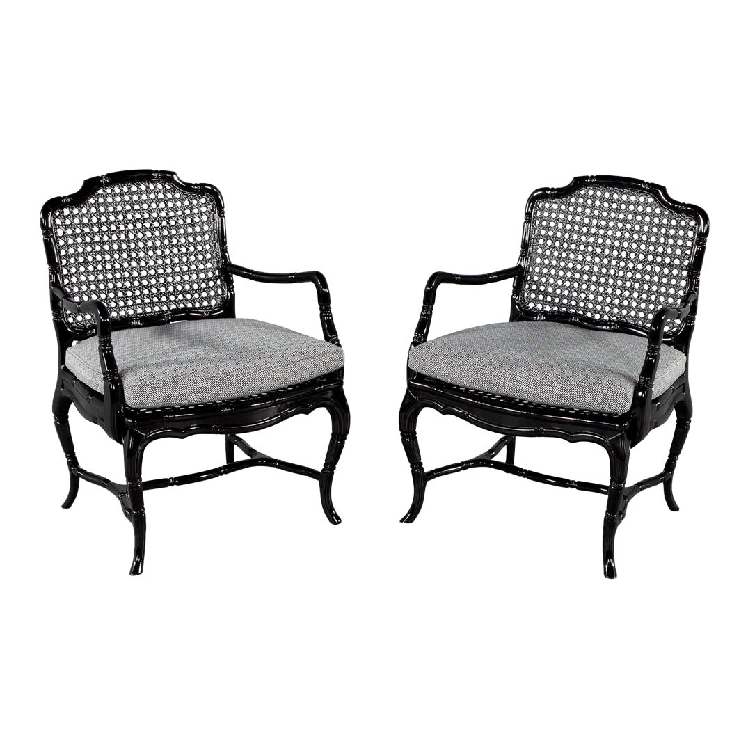 Pair of Black Lacquered Cane Back Lounge Chairs