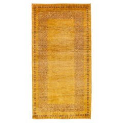 Moderner persischer Gabbeh gelber handgefertigter Wollteppich mit geometrischem Muster