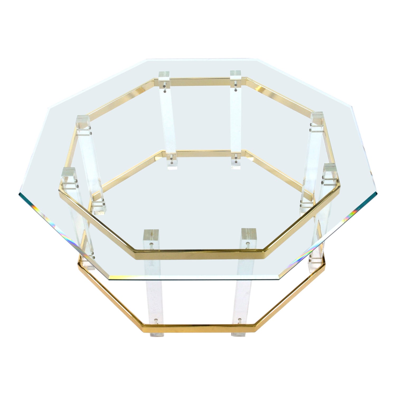 Vintage 1980s Charles Hollis Jones style lucite and brass coffee table with beveled hexagon glass top. The geometric beveled glass top creates a silhouette mimicking the dynamic angles and form of the table base. Vertical acrylic architectural