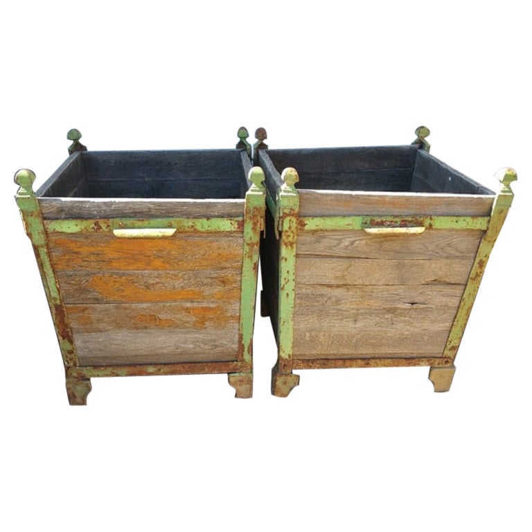 Pair of oak & iron planters, 19th century.

Item #: GE-0111

Additional information:
- Material: Oak, iron
- Dimensions: 29”H x 23,5”SQ.