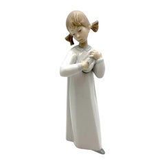 Vintage Porcelain figurine of a girl with an instrument, Lladro, Spain, 1970s