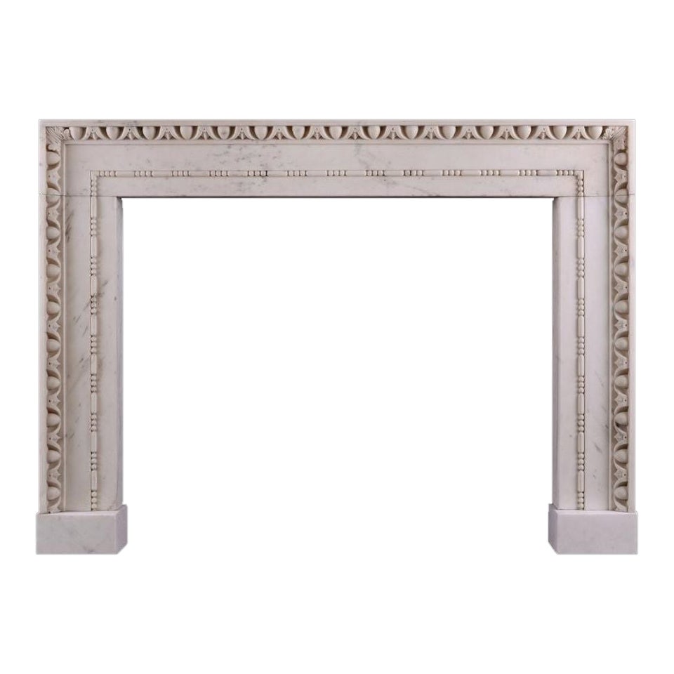A Statuary Marble Fireplace in the Architectural Style For Sale