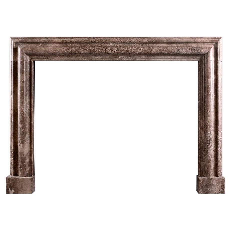 An English Marble Bolection Fireplace