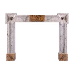 Antique An Early Georgian Siena and Statuary Marble Fireplace