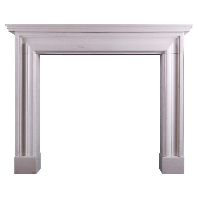 English Moulded Bolection Fireplace in White Marble For Sale