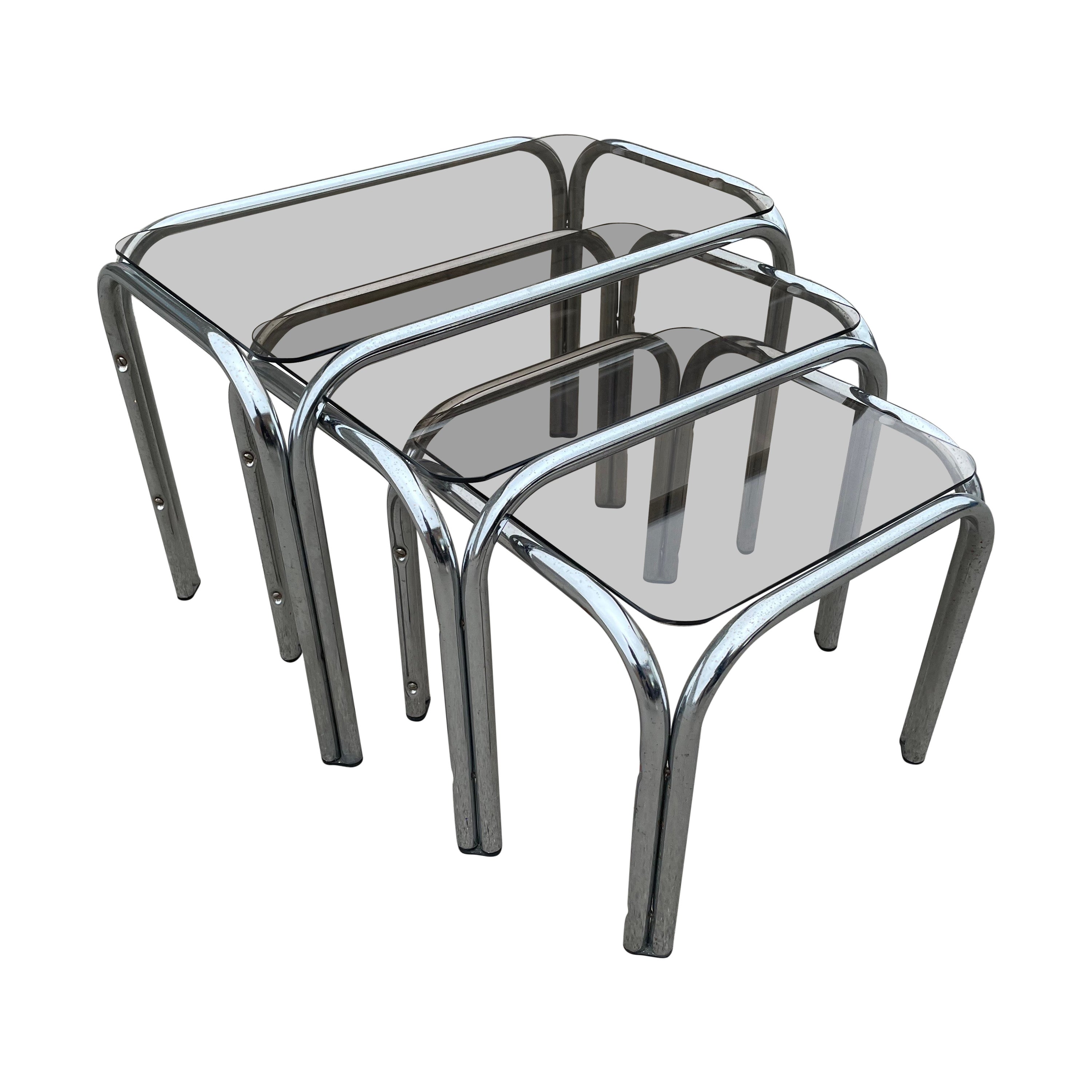A set of Chrome and Smoked Glass nesting tables 1970’s 