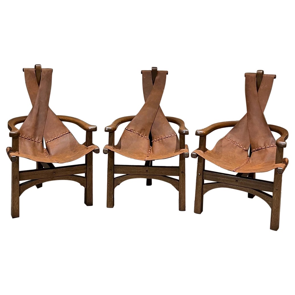 1970s Modern Safari Lounge Set Three Leather Sling Chairs Wood Tripod Leg Base For Sale