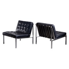 Pair of Kurt Thut side chairs with black leather tufted cushions