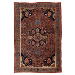Ancien tapis Bidjar rouge en laine persane fait  la main avec motif floral en mdaillon