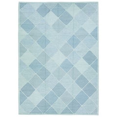 Tapis moderne en laine de style sudois fait  la main avec un design gomtrique turquoise