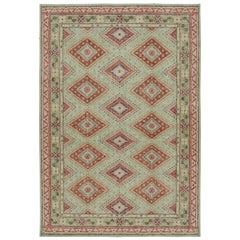 Rug & Kilim’s Distressed Tribal Style Rug in Bright Green with Red Medallions