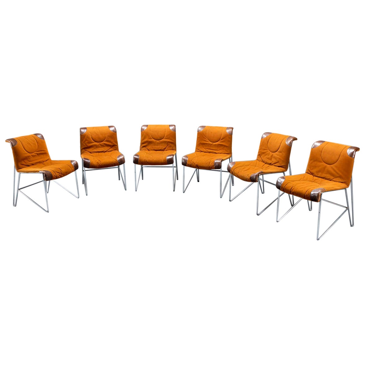 Six Orange Chairs by Guido Faleschini
Tubular Steel Structure, Leather and Alcantara upholstery. 
Manufactured by Mariani, Italy, 1970s

Width 55 x Depth 80 x Height 63 Cm

Faleschini graduated in Architecture at the Atheneaum de Lousanne in 1960.