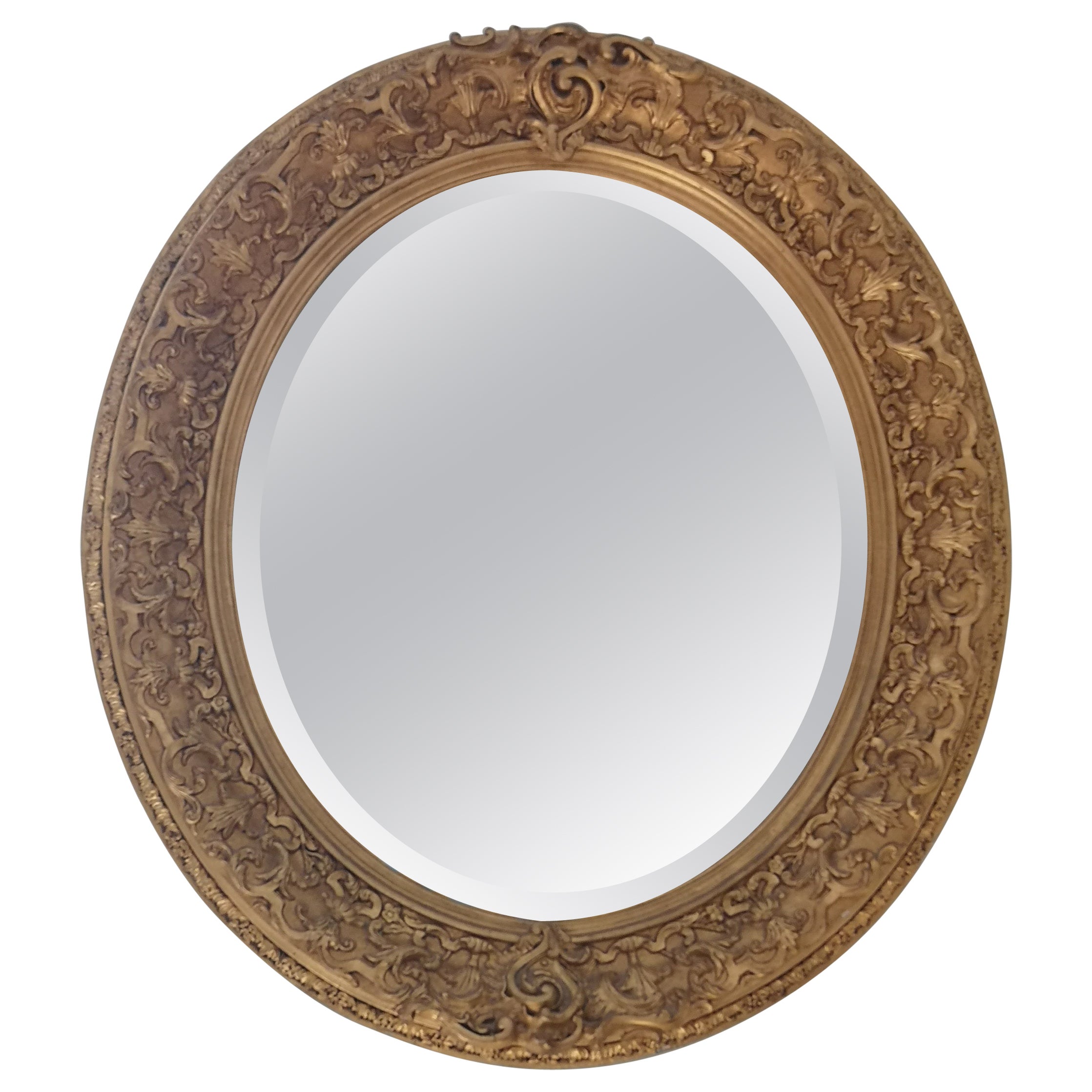 Louis XVI oval mirror in gilded wood and stucco from the 19th century For Sale