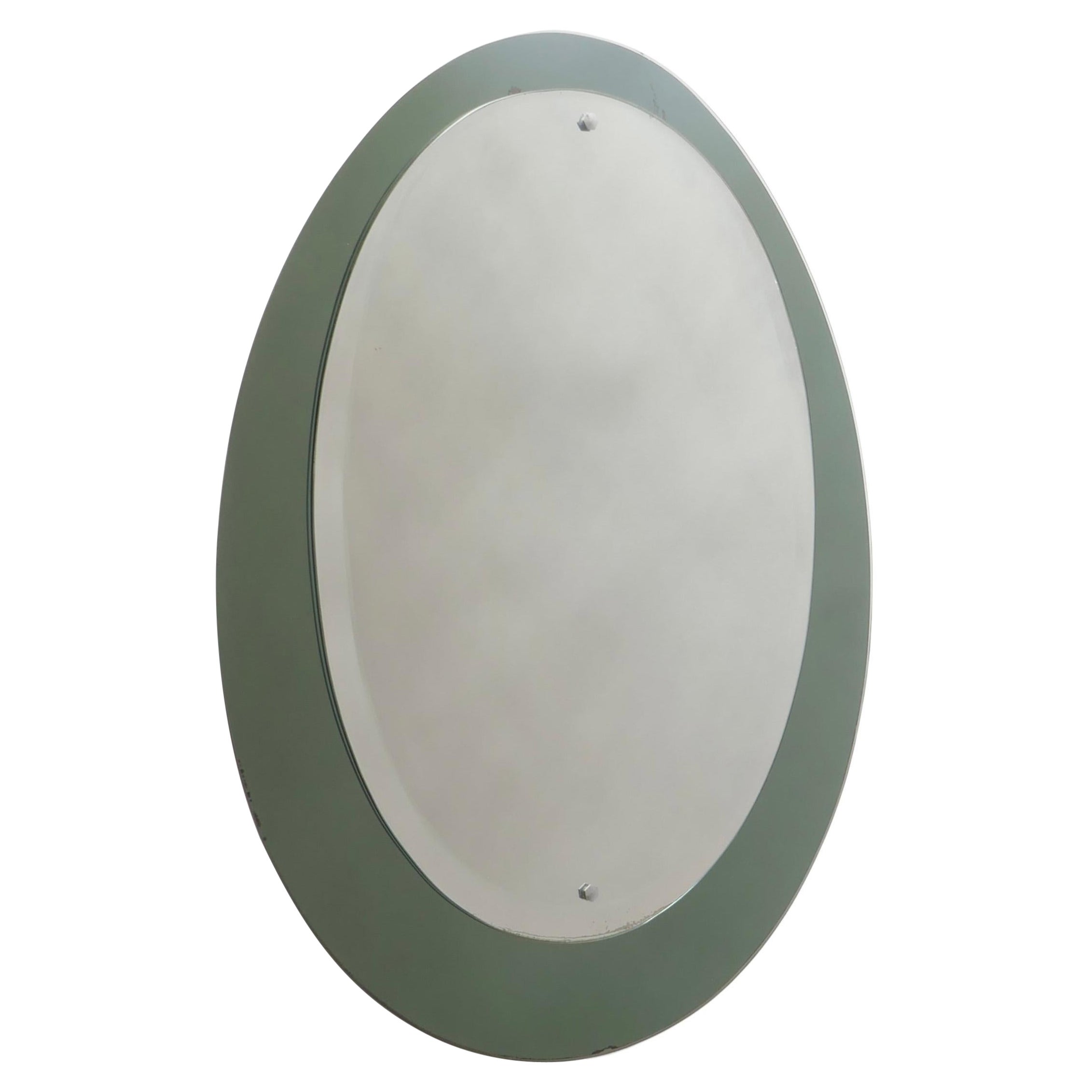 Miroir ovale du milieu du siècle avec cadre en miroir fumé vert, Italie