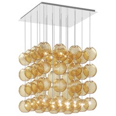 Lampe à suspension Vistosi en verre rayé ambré et cadre en acier miroir