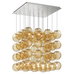 Lampe à suspension Vistosi en verre rayé ambré et cadre en nickel satiné