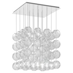 Lampe à suspension Vistosi en verre rayé cristal et cadre en acier miroir