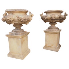 Pair of Cast and Patinated Stone French Lion Vases on 3-Piece Plinths