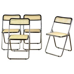 Set of 4 Italian folding chairs in fake cane in the style of Piretti, 1980s