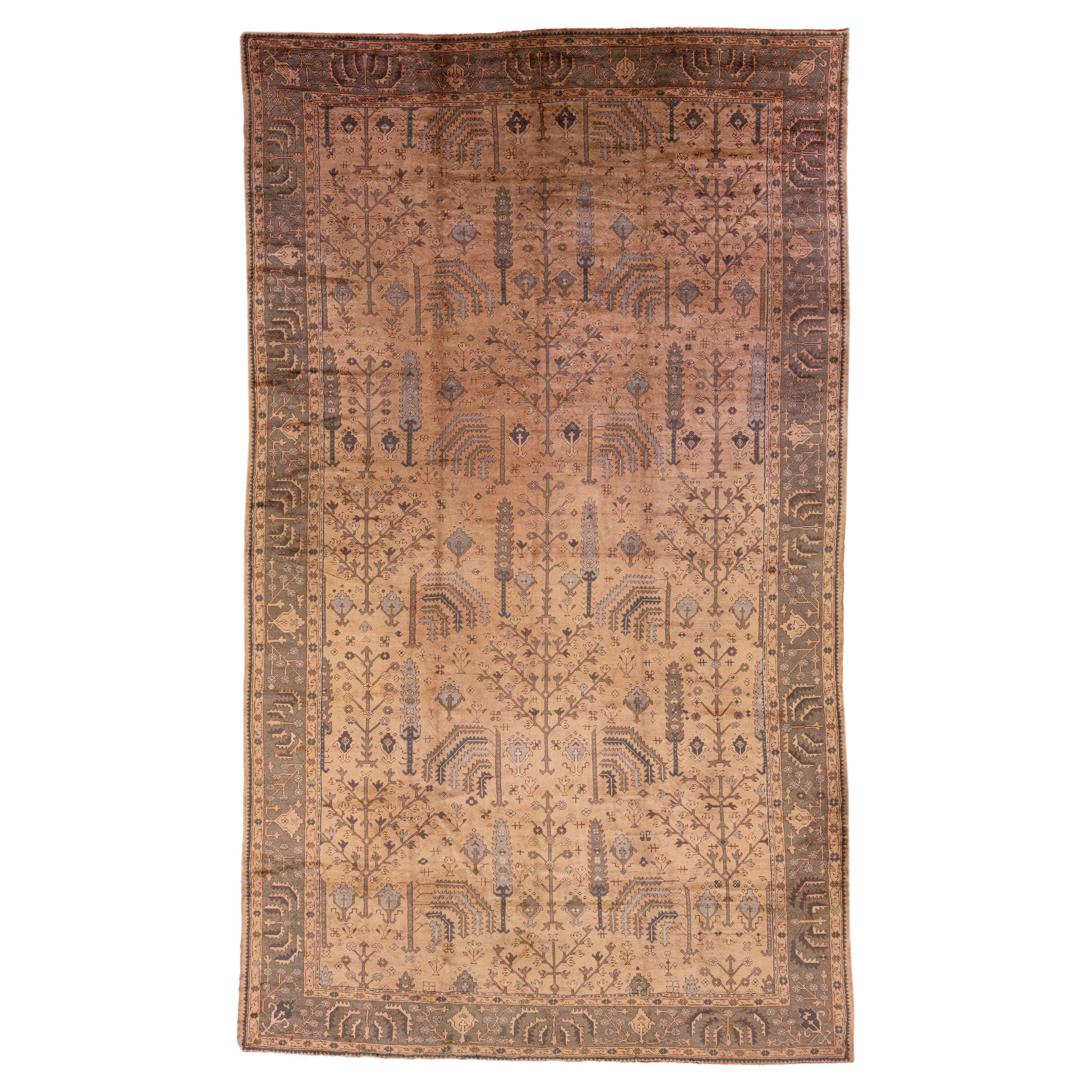 Handmade Floral Antique Turkish Oushak Oversize Wool Rug with Allover Tan Field For Sale