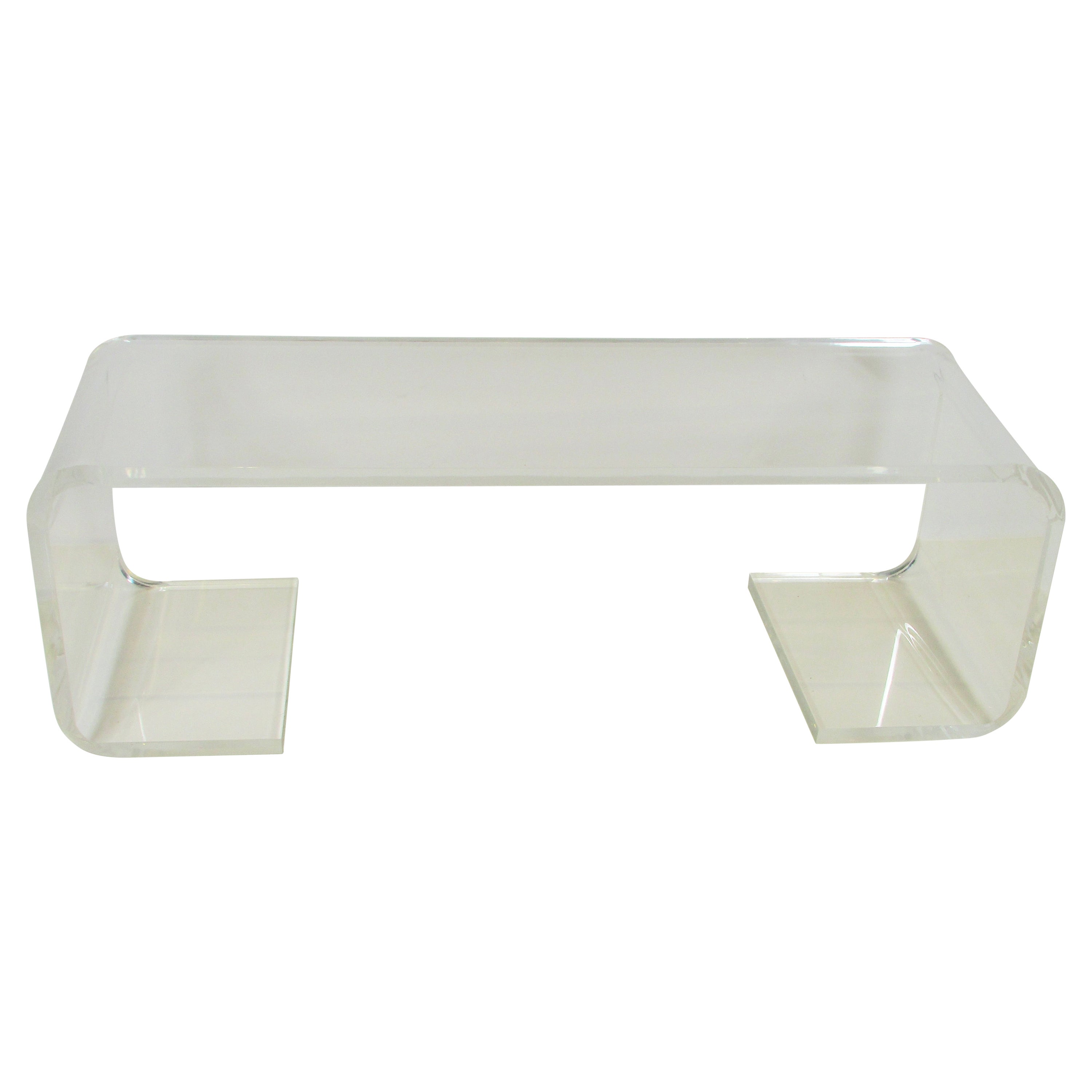 Large thick Lucite coffee table or bench For Sale