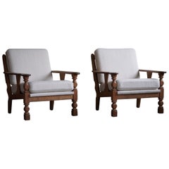Pair of Danish Modern Lounge Chairs in Oak & Bouclé, Henning Kjærnulf, 1960s