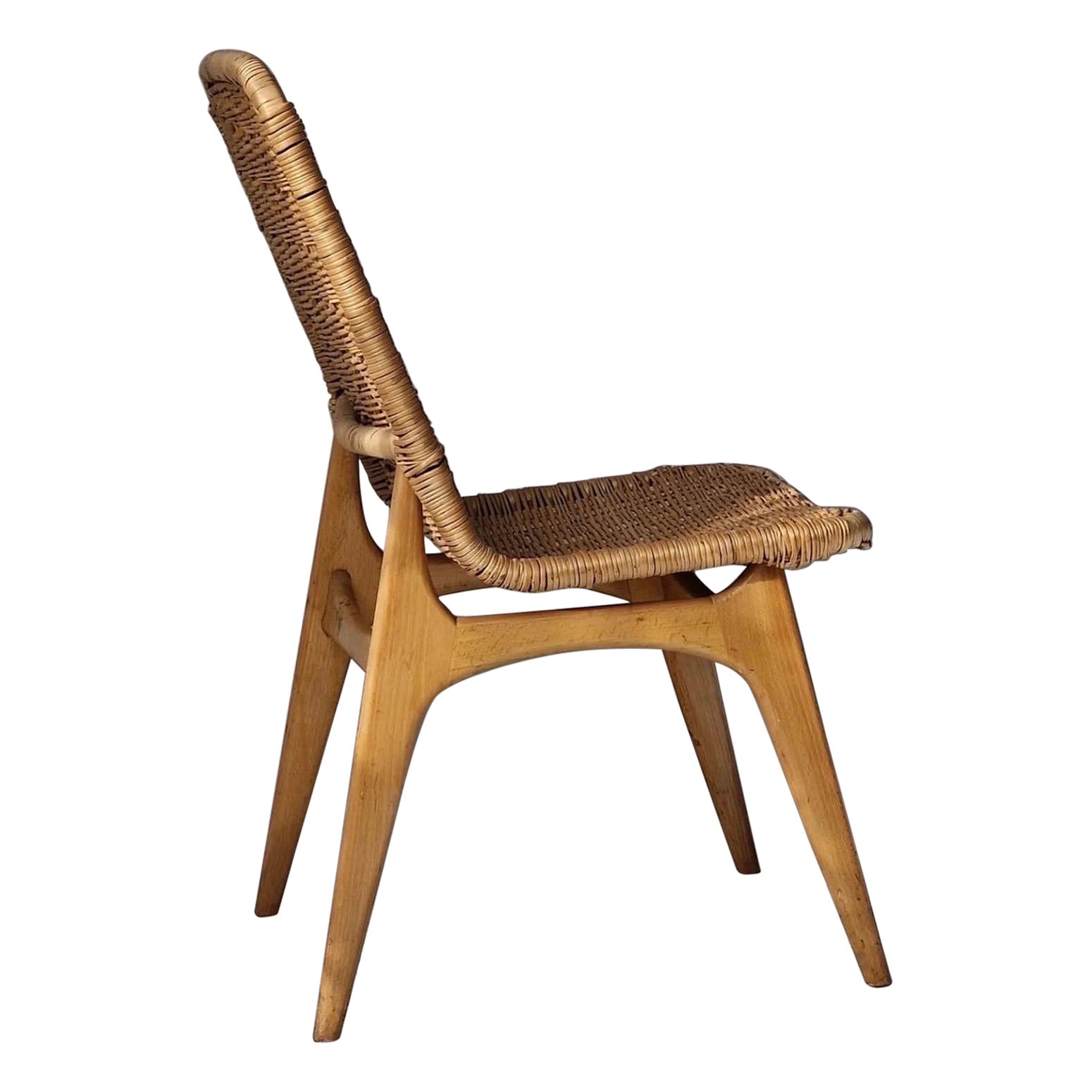 Fauteuil en rotin, vers 1955