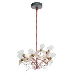 Lámpara colgante "Birdie" en rojo y alas de pluma de ganso para Ingo Maurer