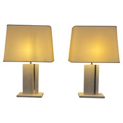  Pair of travertine and brass lamps