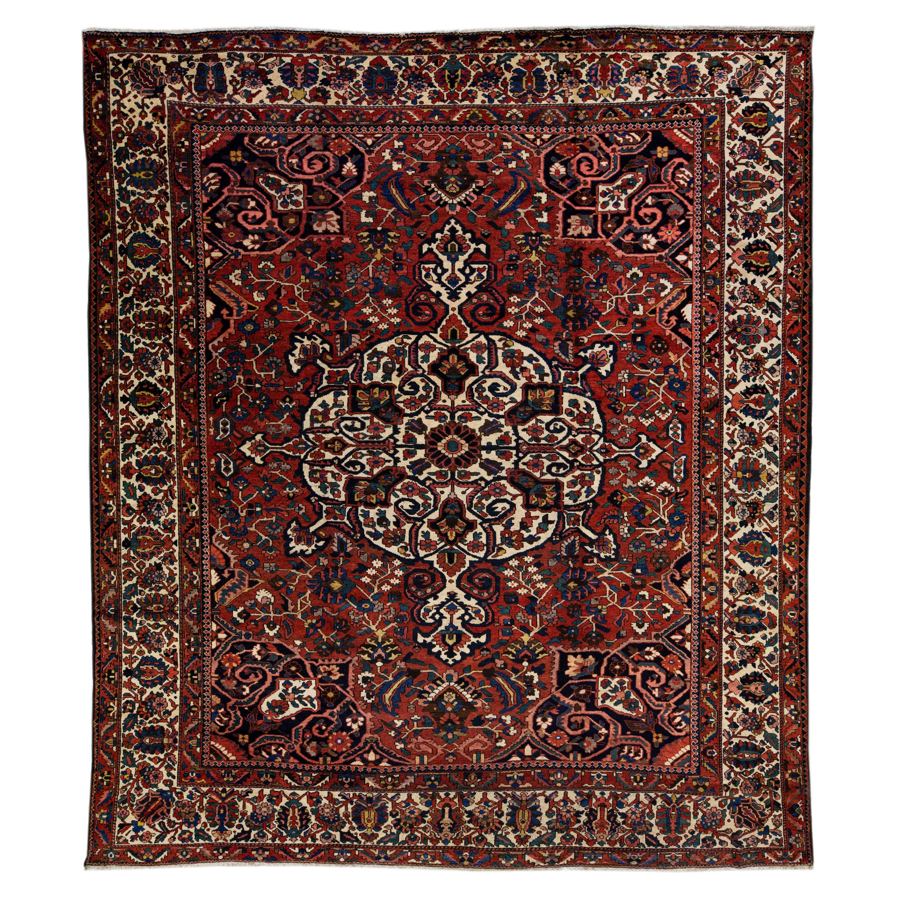 Red Handmade Antique Persian Bakhtiari Rosette Wool Rug  For Sale