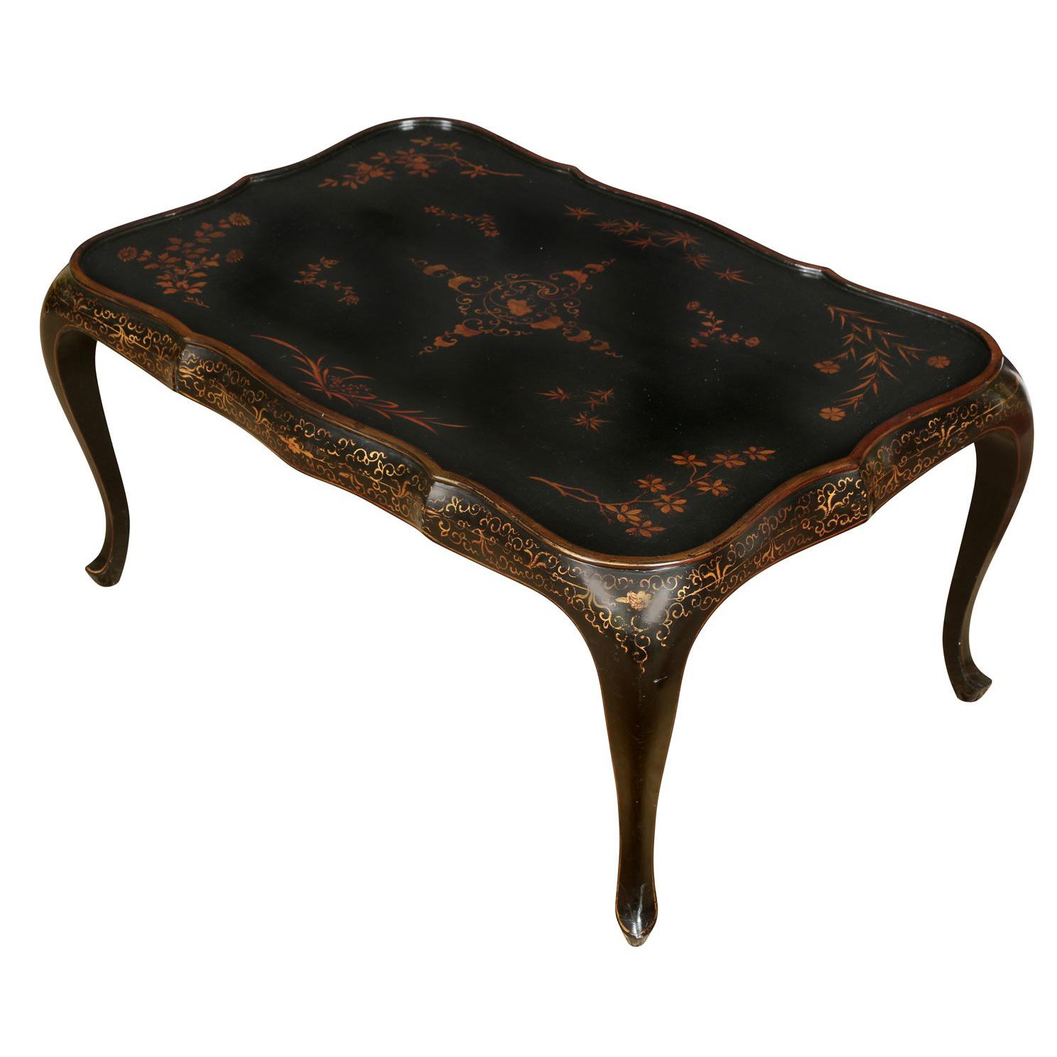 A Black Lacquer and Gold Cocktail Table For Sale