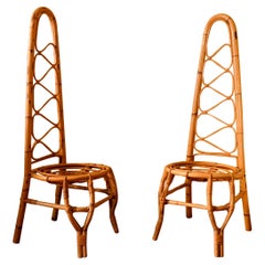 Pair of High Back Rattan Chairs in the style of Bonacina, Italy, circa 1960