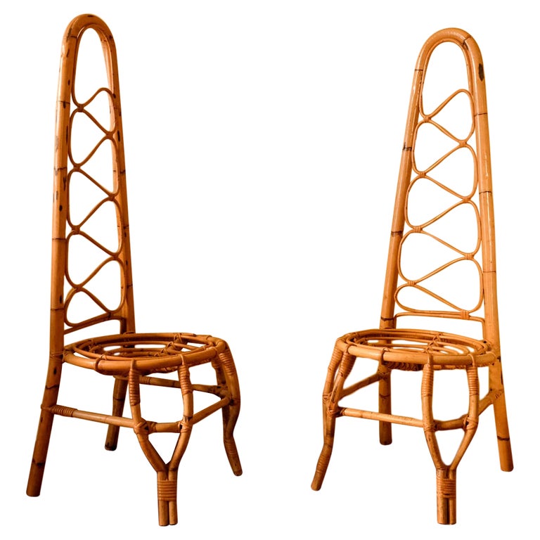 Pair of High Back Rattan Chairs in the style of Bonacina, Italy, circa