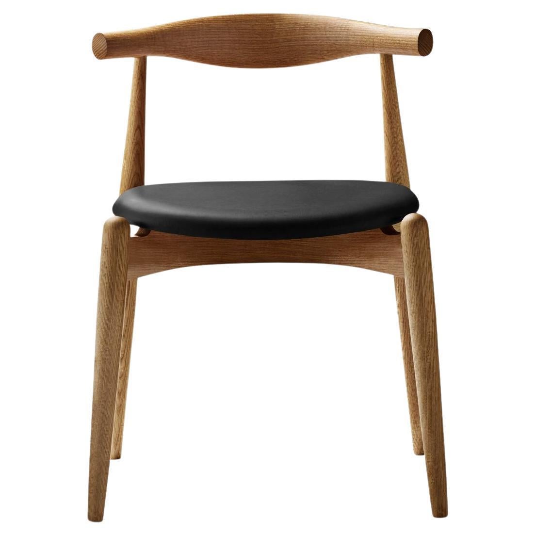 Hans J. Wegner 'CH20' Chair in Oak, Black Leather and Oil for Carl Hansen & Son For Sale