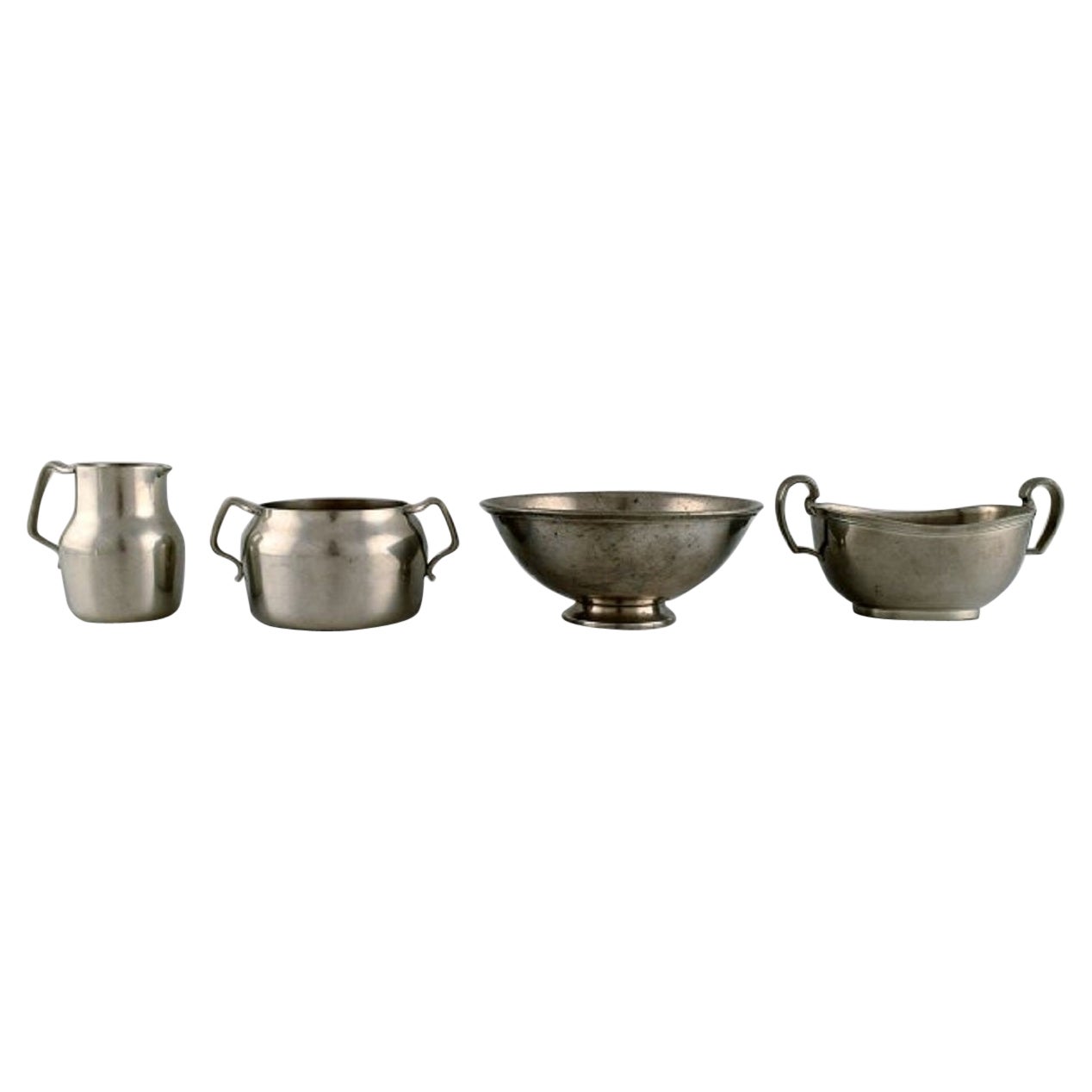 Just Andersen (1884-1943), Denmark. Art Deco pewter creamer and three bowls.