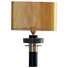 Patinated bronze and brass table lamp, black and green. Gold shade
