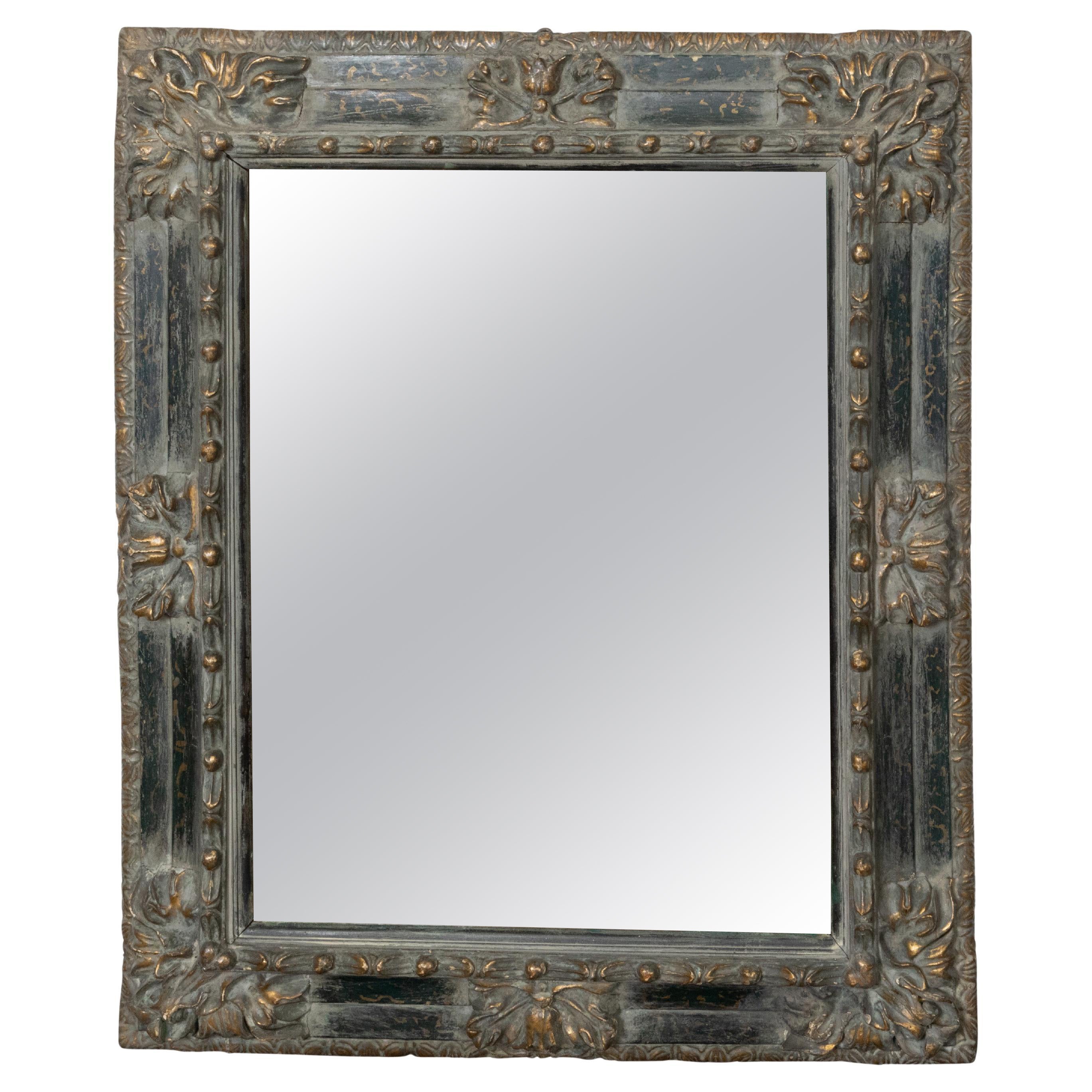 Italian 18th Century Carved and Parcel-Gilt Wooden Mirror with Foliage