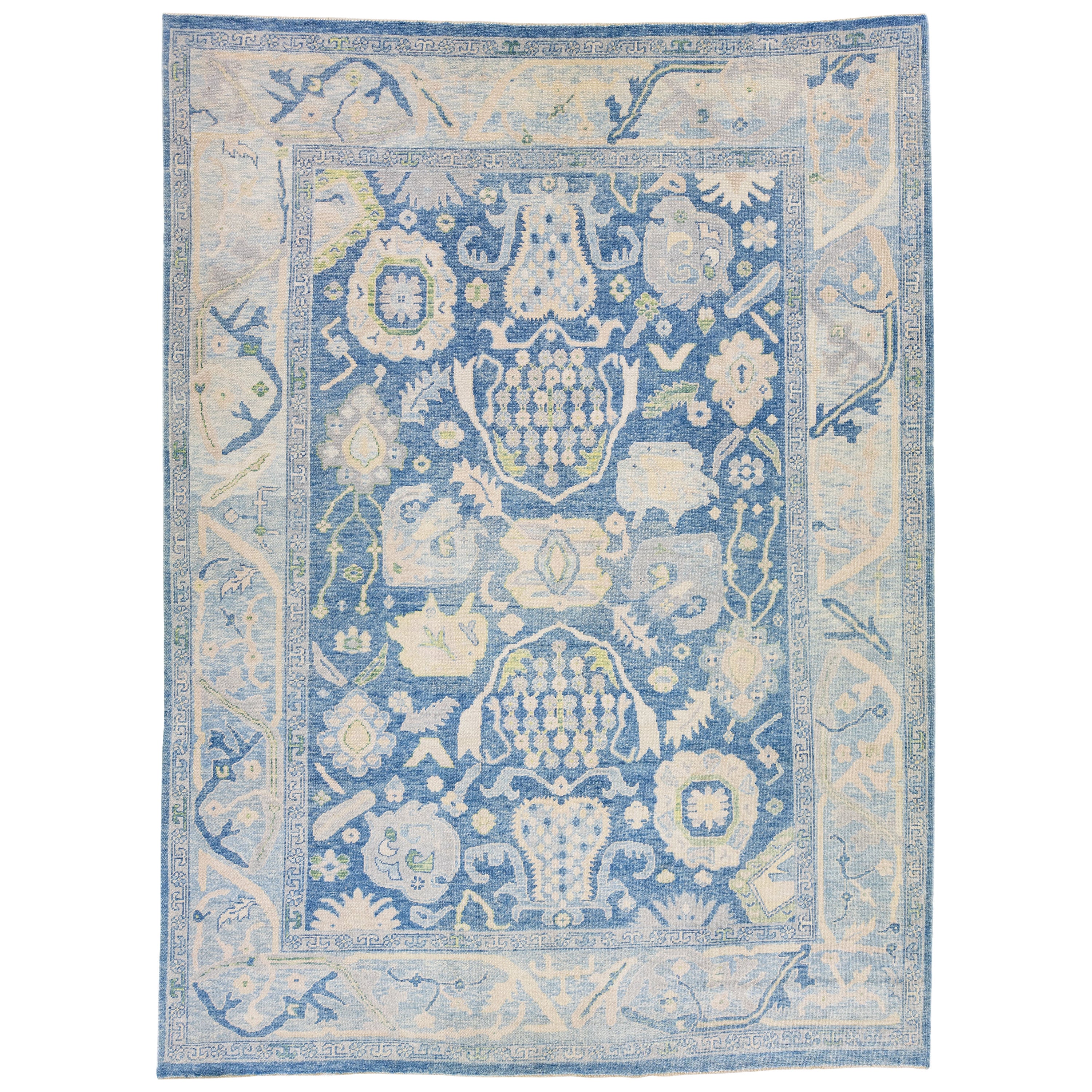 Handmade Floral Modern Oushak Turkish Wool Rug with Blue Field For Sale