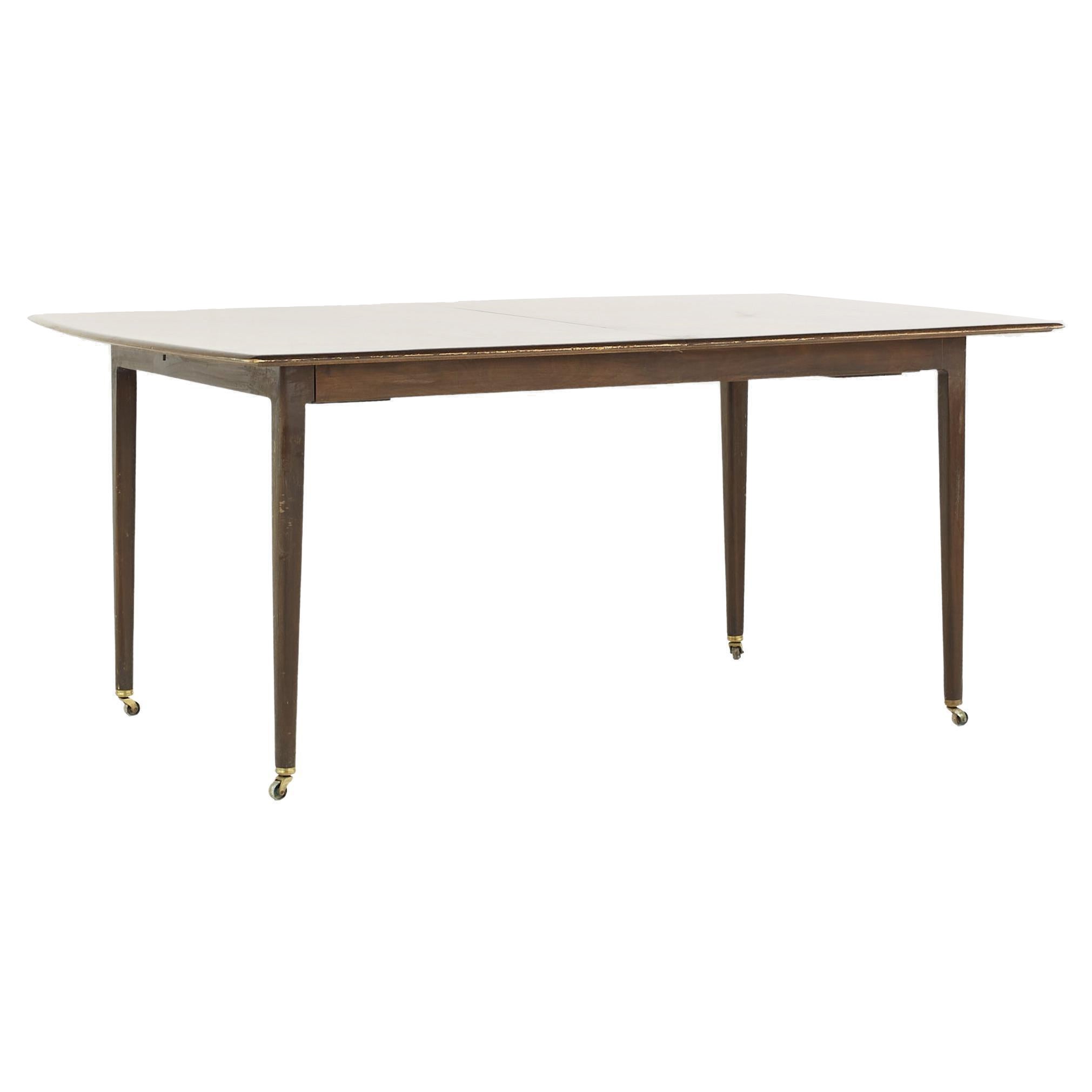 Dunbar Mid Century Expanding Hidden Leaf Walnut Dining Table with 2 Leaves For Sale