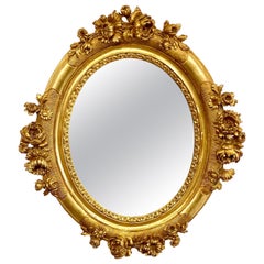 Miroir ovale Louis XVI du 19ème siècle