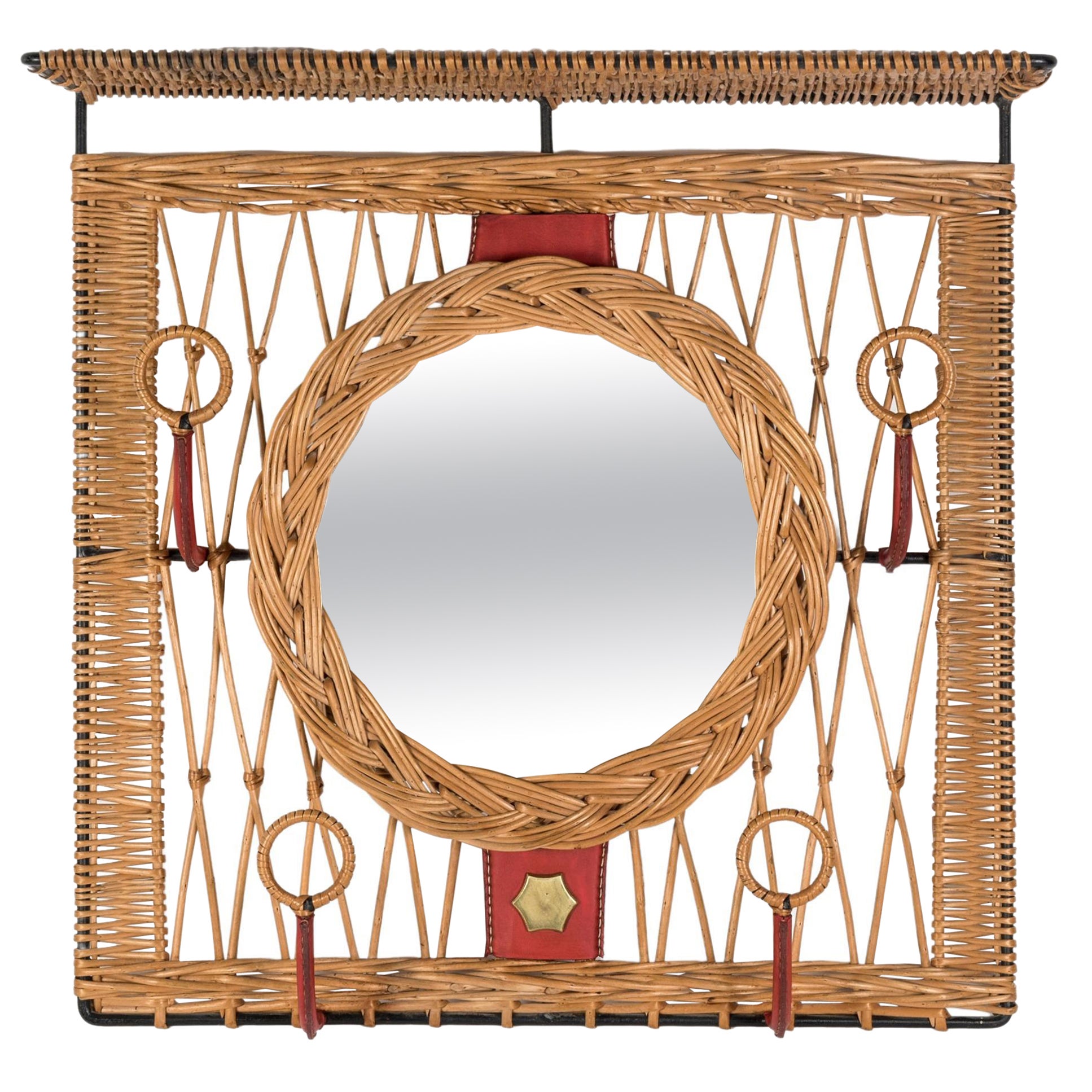 1950's Stitched leather and rattan wall mirror by Jacques Adnet For Sale