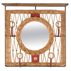 1950's Stitched leather and rattan wall mirror by Jacques Adnet